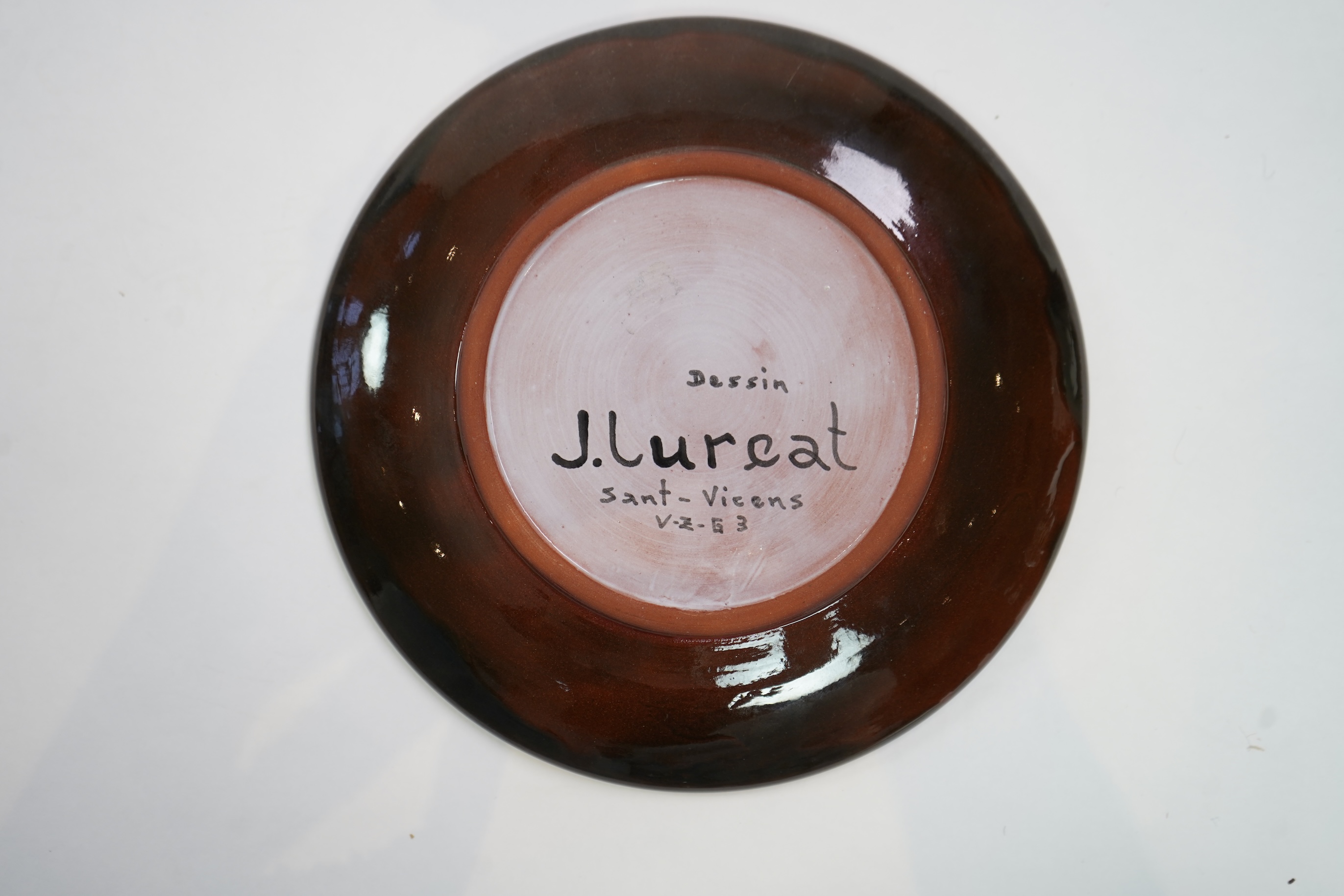 Jean Lurçat (1892-1966): A brown glazed earthenware plate, decorated with a stylised central figure
